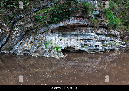 Multi-colored layered rock solid minerals Stock Photo