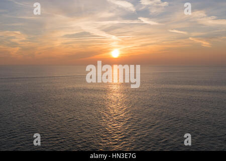 The setting sun viewed from the deck of a brittany Ferries car ferry travelling from Le Havre to Portsmouth Stock Photo