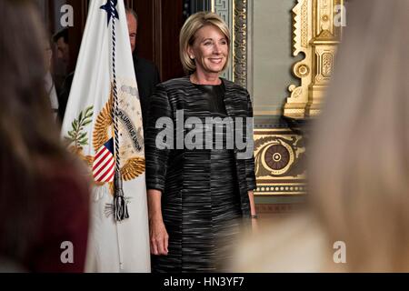 Washington DC, USA. 7th February, 2017. Betsy DeVos, United States Secretary of Education, arrives to be sworn in by U.S. Vice President Mike Pence, not pictured, in the Vice President's Ceremonial Office in Washington, DC, U.S.,DeVos squeaked through a history-making Senate confirmation vote to become U.S. education secretary, as Vice President Mike Pence broke a 50-50 tie and Republicans staved off last-minute defections that would have killed her nomination. Credit: Andrew Harrer/Pool via CNP /MediaPunch Credit: MediaPunch Inc/Alamy Live News Stock Photo