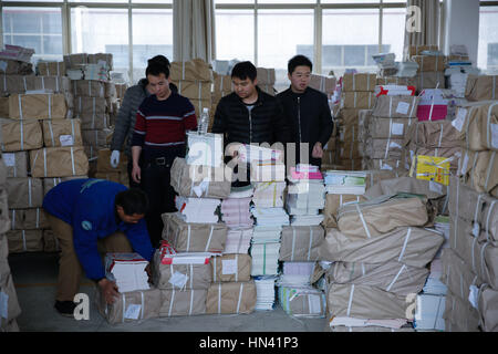 Shaoyan, Shaoyan, China. 6th Feb, 2017. Shaoyang, CHINA-February 6 2017: (EDITORIAL USE ONLY. CHINA OUT) .Personnel of Xinhua Bookstore are busy distributing notebooks for students in Shaoyang City, central China's Hunan Province, February 6th, 2017, preparing for the upcoming new semester. Credit: SIPA Asia/ZUMA Wire/Alamy Live News Stock Photo