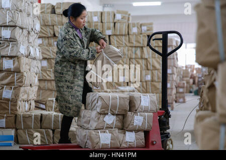 Shaoyan, Shaoyan, China. 6th Feb, 2017. Shaoyang, CHINA-February 6 2017: (EDITORIAL USE ONLY. CHINA OUT) .Personnel of Xinhua Bookstore are busy distributing notebooks for students in Shaoyang City, central China's Hunan Province, February 6th, 2017, preparing for the upcoming new semester. Credit: SIPA Asia/ZUMA Wire/Alamy Live News Stock Photo