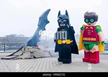 London, UK. 8th Feb, 2017. LEGO Batman and Robin costumed characters pose with a giant LEGO Batarang, which has crash landed at Observation Point on the South Bank. Created to celebrate the release of The LEGO Batman Movie, the Batarang has been made from 35,000 LEGO bricks by the UK's leading LEGO builder, Duncan Titmarsh from Bright Bricks, and will be in place until Thursday evening, with the movie released in UK cinemas on Friday. Credit: Stephen Chung/Alamy Live News Stock Photo