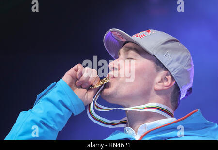 St. Moritz, Germany. 08th Feb, 2017. Erik Guay of Canada kissing his gold medal at the victory ceremony for the Super G men's eventz at the Alpine Skiing World Cup in St. Moritz, Germany, 08 February 2017. Photo: Michael Kappeler/dpa/Alamy Live News Stock Photo