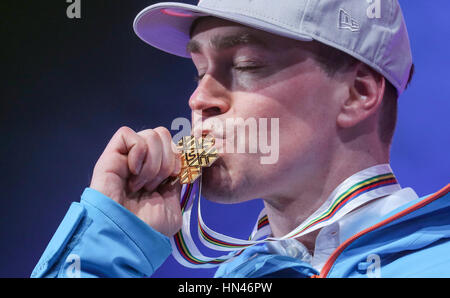 St. Moritz, Germany. 08th Feb, 2017. Erik Guay of Canada kissing his gold medal at the victory ceremony for the Super G men's event at the Alpine Skiing World Cup in St. Moritz, Germany, 08 February 2017. Photo: Michael Kappeler/dpa/Alamy Live News Stock Photo
