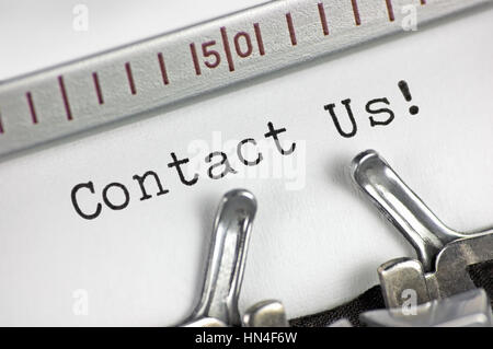 Typewriter detailed macro closeup typing text Contact Us, large detail vintage customer service metaphor concept studio shot, horizontal Stock Photo