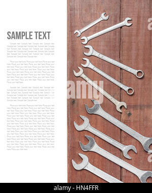 wrenches on wooden plank background Stock Photo