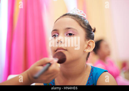 doing princess make up for small kid girl Stock Photo