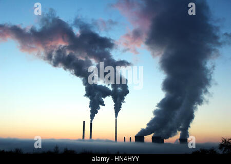 emission from brown coal power plant during the sunset Stock Photo