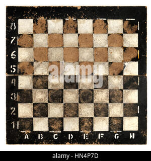 Isolated objects: very old empty chess board, isolated on white background Stock Photo