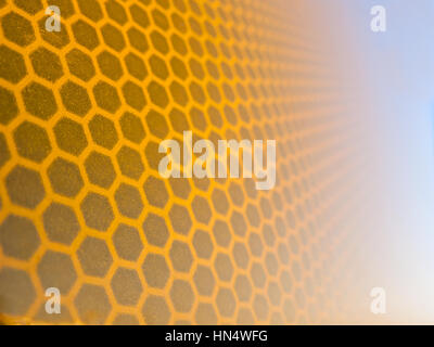 Honeycomb background texture from a reflective surface of a traffic sign Stock Photo