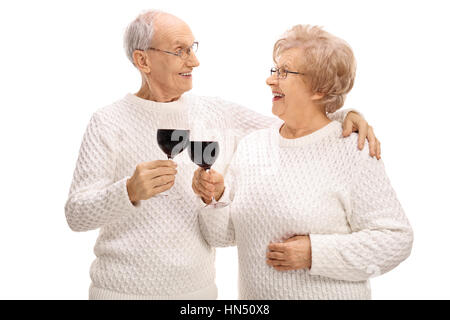 Mature couple making a toast with wine isolated on white background Stock Photo