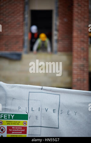 PJ Livesey builders working on their new build development building site in Didsbury, South Manchester, England, UK. Stock Photo