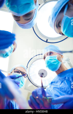 Team of surgeons over the operating table Stock Photo