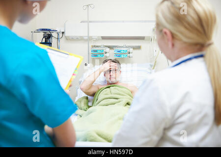 Doctors telling patient the diagnosis Stock Photo