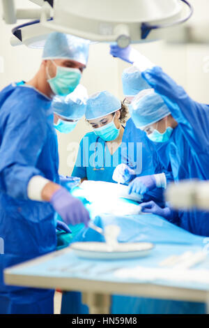 Hard working doctors during operating Stock Photo