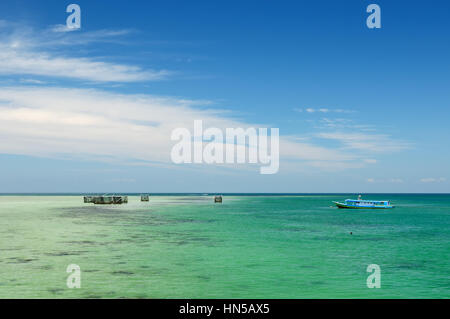 A remote Derawan islands located in  Sangalaki archipelag on the East Kalimantan. The are rich coral reefs, turtles and scholing fish. Indonesia Stock Photo