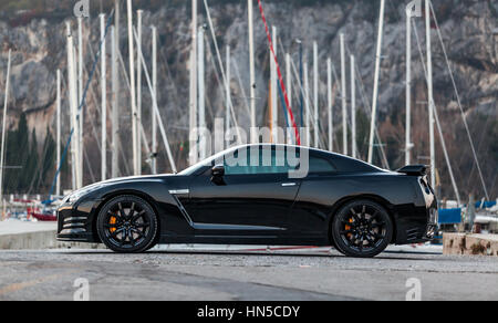 SISTIANA, ITALY JUNE 12, 2013: Photo of a Nissan GT-R Black Edition. The Nissan GT-R is a 2-door 2+2 sports car produced by Nissan and unveiled in 200