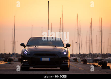 SISTIANA, ITALY JUNE 12, 2013: Photo of a Nissan GT-R Black Edition. The Nissan GT-R is a 2-door 2+2 sports car produced by Nissan and unveiled in 200