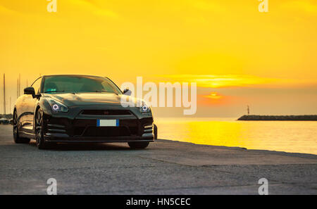 SISTIANA, ITALY JUNE 12, 2013: Photo of a Nissan GT-R Black Edition. The Nissan GT-R is a 2-door 2+2 sports car produced by Nissan and unveiled in 200