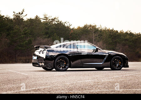 SISTIANA, ITALY JUNE 12, 2013: Photo of a Nissan GT-R Black Edition. The Nissan GT-R is a 2-door 2+2 sports car produced by Nissan and unveiled in 200