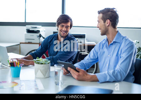 Two male graphic designers working together in office Stock Photo