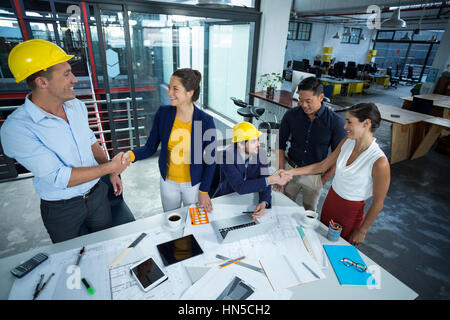 Business executives discussing during meeting in office Stock Photo