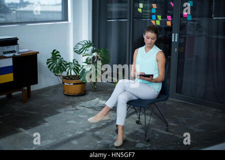 Graphic designer using laptop at his desk in office Stock Photo