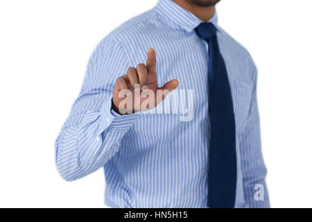 Mid section of businessman using invisible screen against white background Stock Photo