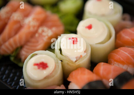 Close-up of assorted sushi set served in plastic boxes Stock Photo