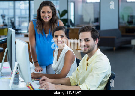 Portrait of graphic designers working on personal computer in office Stock Photo