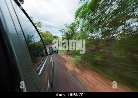 view side of car moving fast in green area Stock Photo