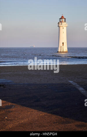 Liverpool bay sunrise at New Brighton Fort Perch Rock and Lighthouse Marine Promenade in Wallasey, Merseyside, Wirral, England, UK. Stock Photo