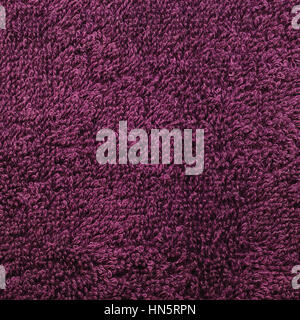Bath towel, crimson, pink, vine, raspberry, red, natural plush terry cloth turkish / beach textured fabric macro background closeup texture pattern Stock Photo