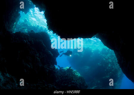 Scuba diver at St. John's Caves, Red Sea Stock Photo