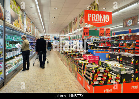 TURNHOUT, BELGIUM - OCTOBER 2016: Interior of a Lidl supermarket. Shopper choose in the refrigerated fresh products aisle. Stock Photo