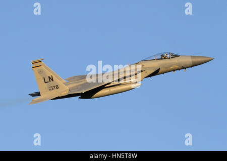 A Lakenheath F-15C from the 493rd Fighter Squadron climbing out of the base at dawn. Stock Photo