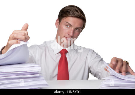 business man overloaded with paper work sitting at his desk Stock Photo