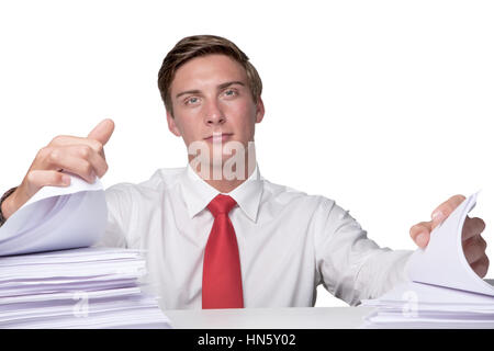 business man overloaded with paper work sitting at his desk Stock Photo