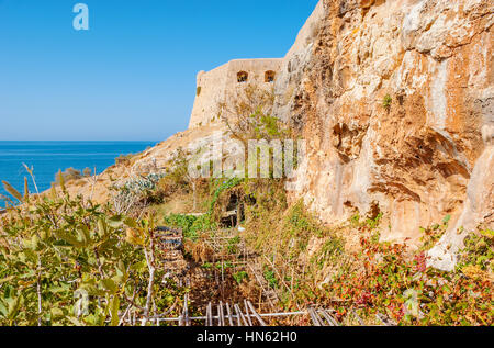 The garden of Ekklisia Agios Spiridon cave temple located on the sunny side of the Venetian fortress in Rethymno, Greece Stock Photo