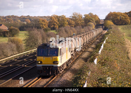 OTFORD JUNCTION, KENT, ENGLAND - NOVEMBER 11TH 2008 - An EWS class 92 electric locomotive with a freight train comprising of loaded china clay tanks.  Stock Photo