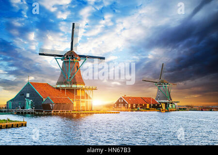 Cumulus clouds on sunset over dutch windmills in Rotterdam. Neth Stock Photo
