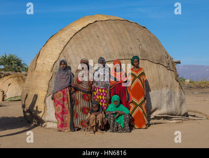 Portrait of Afar tribe women in front of their traditional hut, Afar region, Afambo, Ethiopia Stock Photo