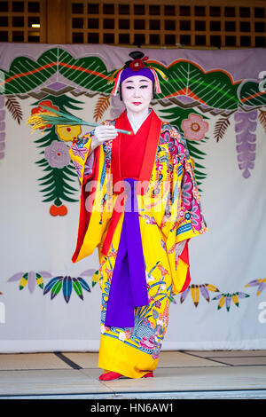 NAHA, JAPAN - APRIL 1: A performer demonstrates Ryukyu dance in Naha, Japan on 1st April 2012. The imperial court dance was historically performed in  Stock Photo