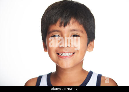 portrait of smiling hispanic boy isolated on white Stock Photo