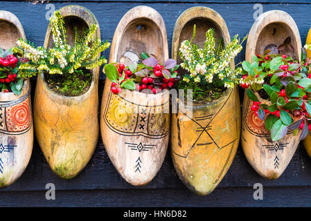 Row Of Shoes With Flowers In Them Stock Photo Alamy