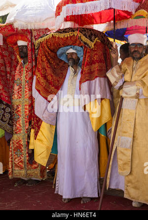 Ethiopian priests carrying some covered tabots on their heads during Timkat epiphany festival, Amhara region, Lalibela, Ethiopia Stock Photo