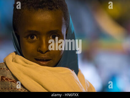 Young ethiopian girl during Timkat epiphany festival at night, Amhara region, Lalibela, Ethiopia Stock Photo