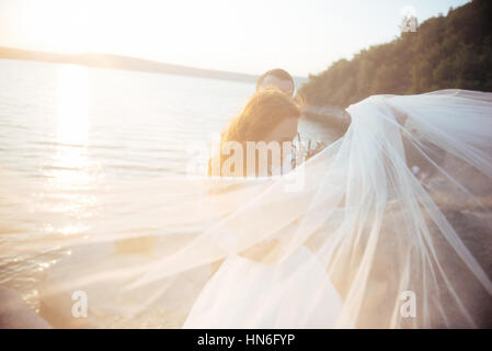 beautiful lovely blonde bride and groom classy on the rocks, ami Stock Photo