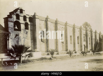 Antique c1910 photograph, the facade of Mission San Gabriel. The Mission San Gabriel Arcángel is a fully functioning Roman Catholic mission and a historic landmark in San Gabriel, California, USA. The settlement was founded by Spaniards of the Franciscan order on September 8, 1771. Stock Photo