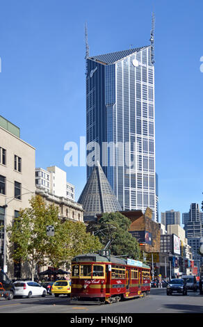 Melbourne, Australia - May 14, 2014: Vintage red tram in La Trobe street. In the background is the central tower and ME Bank Building Stock Photo